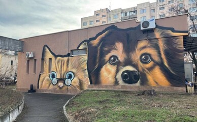 На Виноградарі з'явився душевний мурал із котом та собакою